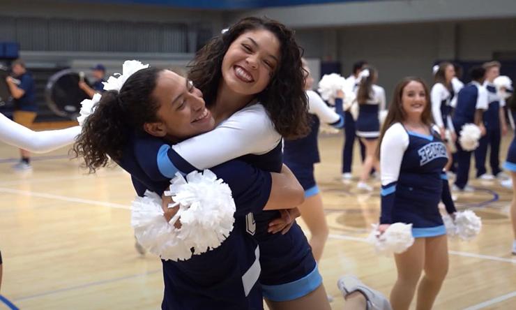 cheerleaders hugging